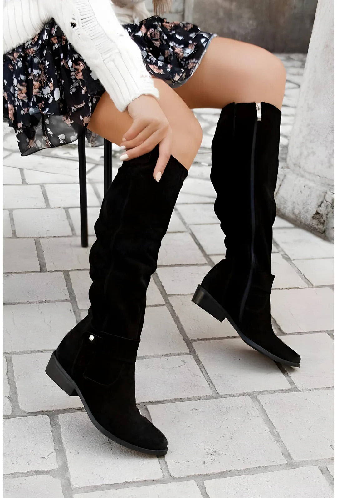 Black knee-high boots with sleek streamlined design, cushioned insole, and structured support for everyday wear