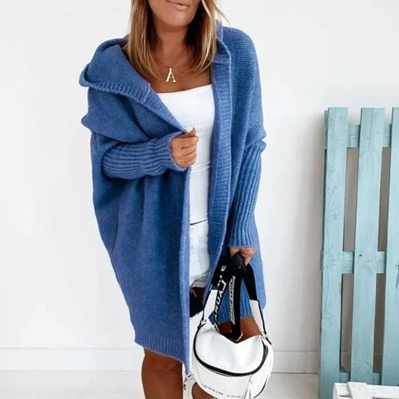 Beige hooded knit cardigan with relaxed silhouette and oversized open-front design for cozy layering