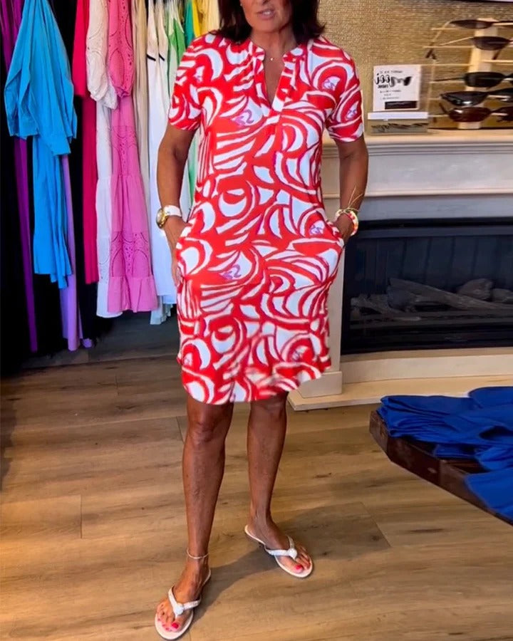 Elegant wide-sleeve midi dress with belted waist in relaxed fit, timeless below-knee silhouette