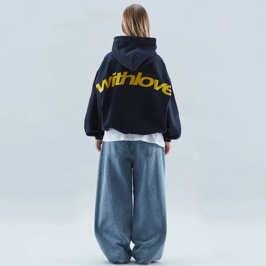 Casual oversized hoodie with loose fit and bold front graphic detail for streetwear styling