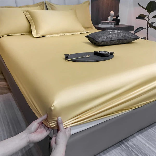 Fitted bed sheets in neutral tones, snug elastic edges for secure all-night comfort on deep mattresses