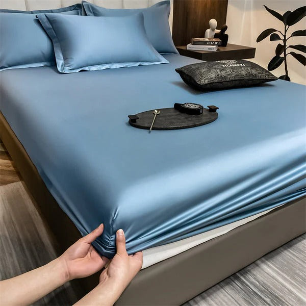 Fitted white bedroom sheets with elastic edges, soft breathable fabric for deep mattresses