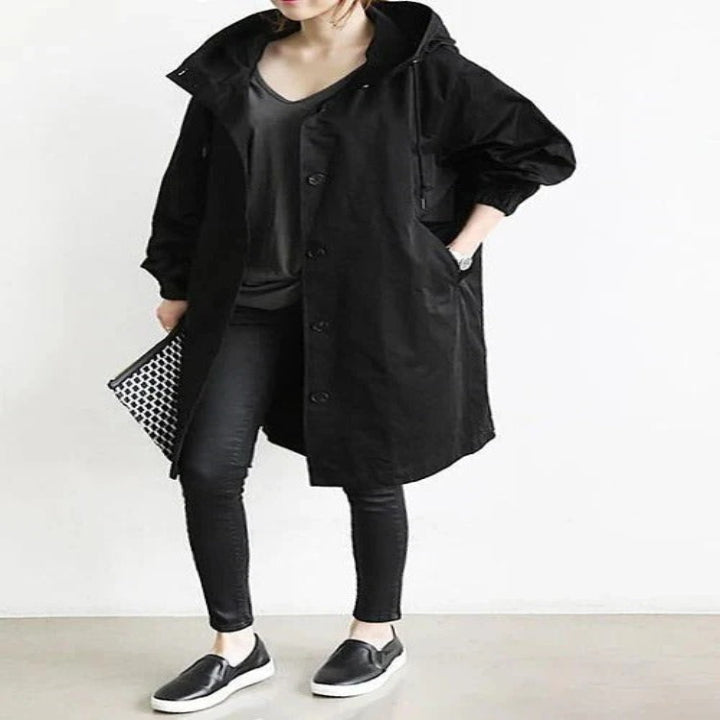Women's water-resistant hooded overcoat, elegant long silhouette with durable weather-repellent finish