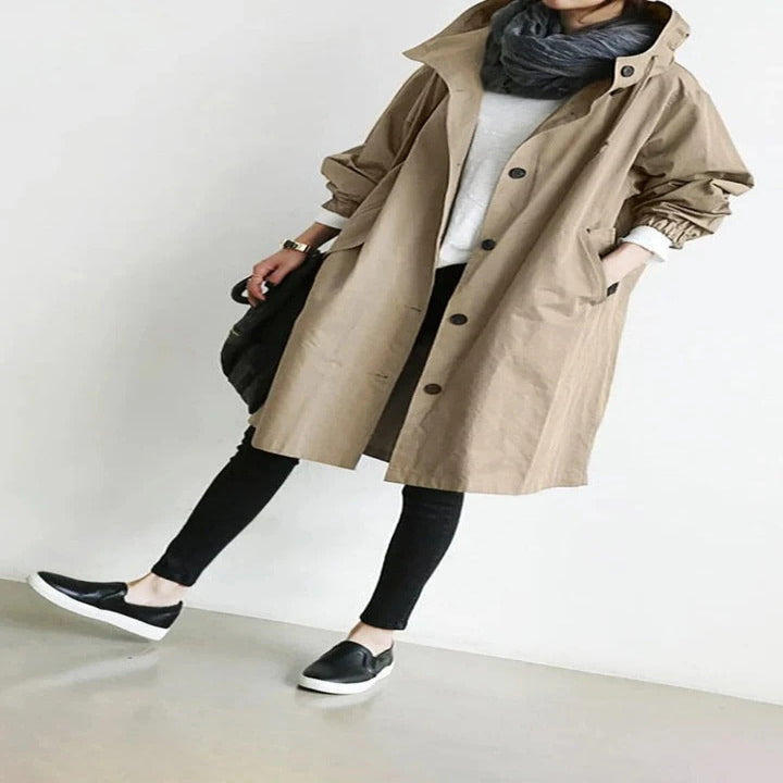 Women's water-resistant hooded overcoat, elegant long silhouette with durable weather-repellent finish