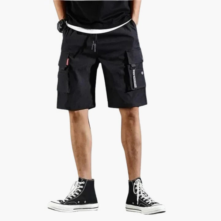 Men's khaki relaxed-fit cargo shorts with multiple utility pockets for travel and outdoor wear