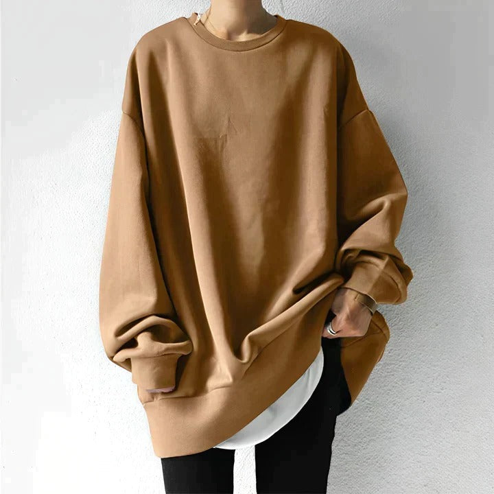 Plus-size women's oversized drapey sweater in neutral tones, relaxed silhouette with curvy-flattering fit