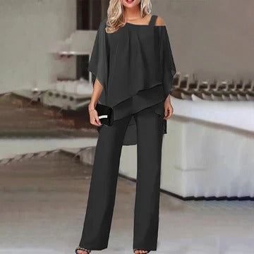 Elegant two-piece cold shoulder top and trousers set in a sleek coordinated design for modern women