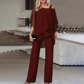 Elegant two-piece cold shoulder top and wide-leg trousers set in neutral tones for polished chic style
