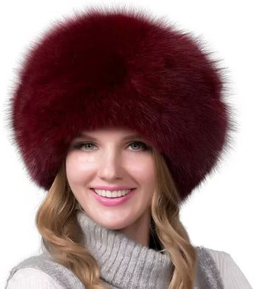 Women's winter hat with integrated earmuffs, dense fur texture, full head coverage, warm refined style