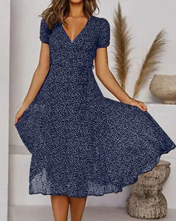 Women's floral print V-neck dress, flowing silhouette in vibrant multicolor blooms for warm-weather ease