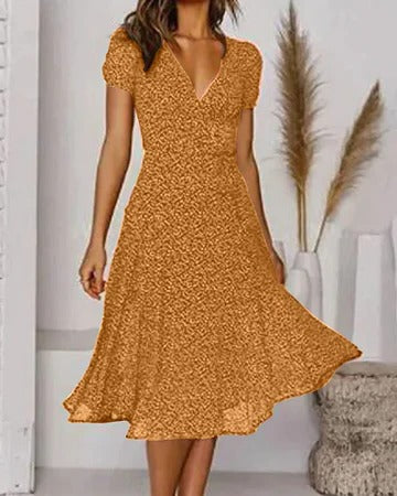 Women's floral print V-neck dress, flowing silhouette in vibrant multicolor blooms for warm-weather style