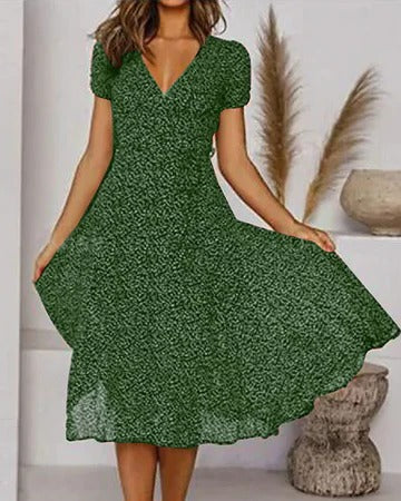 Women's floral print V-neck dress, flowing silhouette in vibrant multicolor bloom pattern