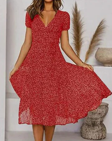 Women's floral print V-neck dress, flowing silhouette in vibrant multicolor bloom pattern