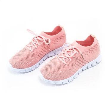 Women's white everyday sneakers with cushioned sole and modern low-top silhouette for all-day comfort