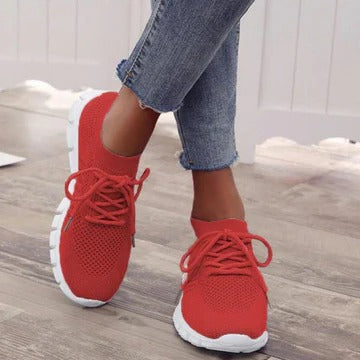 Women's white low-top everyday sneakers with cushioned sole and versatile modern silhouette