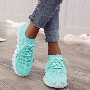 Women's white everyday sneakers with cushioned comfort sole and versatile modern low-top silhouette