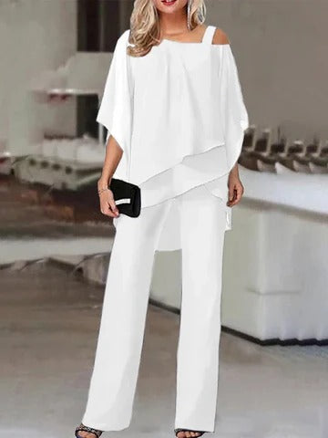 Women's layered cold-shoulder pant set in solid hue with flowing draped top and wide-leg tailored pants