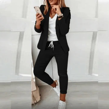 Women's tailored blazer and trousers set with structured silhouette, polished coordinated suit for modern style