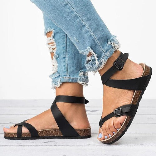 Women's flat basic sandals with adjustable buckle strap in neutral tone, low-profile minimalist design