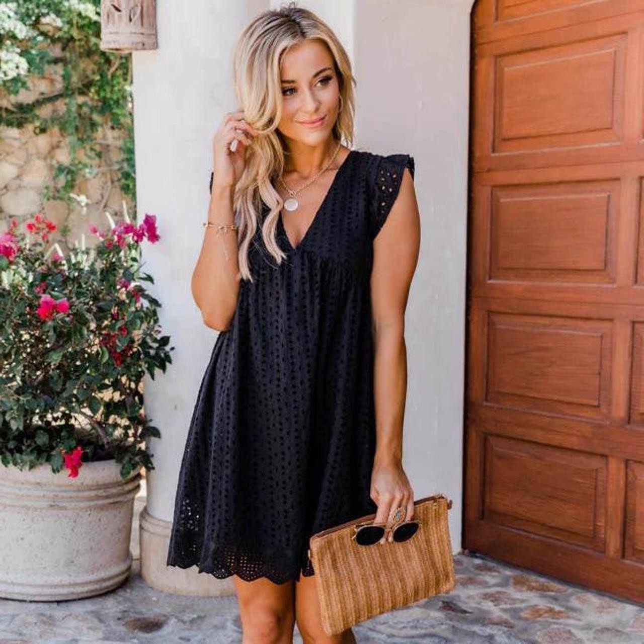 Flowy boho mini dress with built-in shorts, side pockets, relaxed silhouette in neutral tones