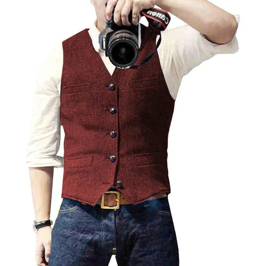 Men's blue denim vest with button closure, slim casual cut, and multiple practical pockets