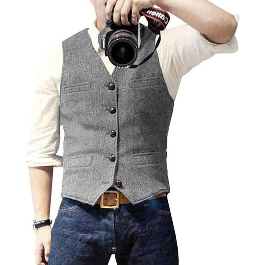 Men's blue denim vest with button closure, slim casual cut, and multiple practical pockets