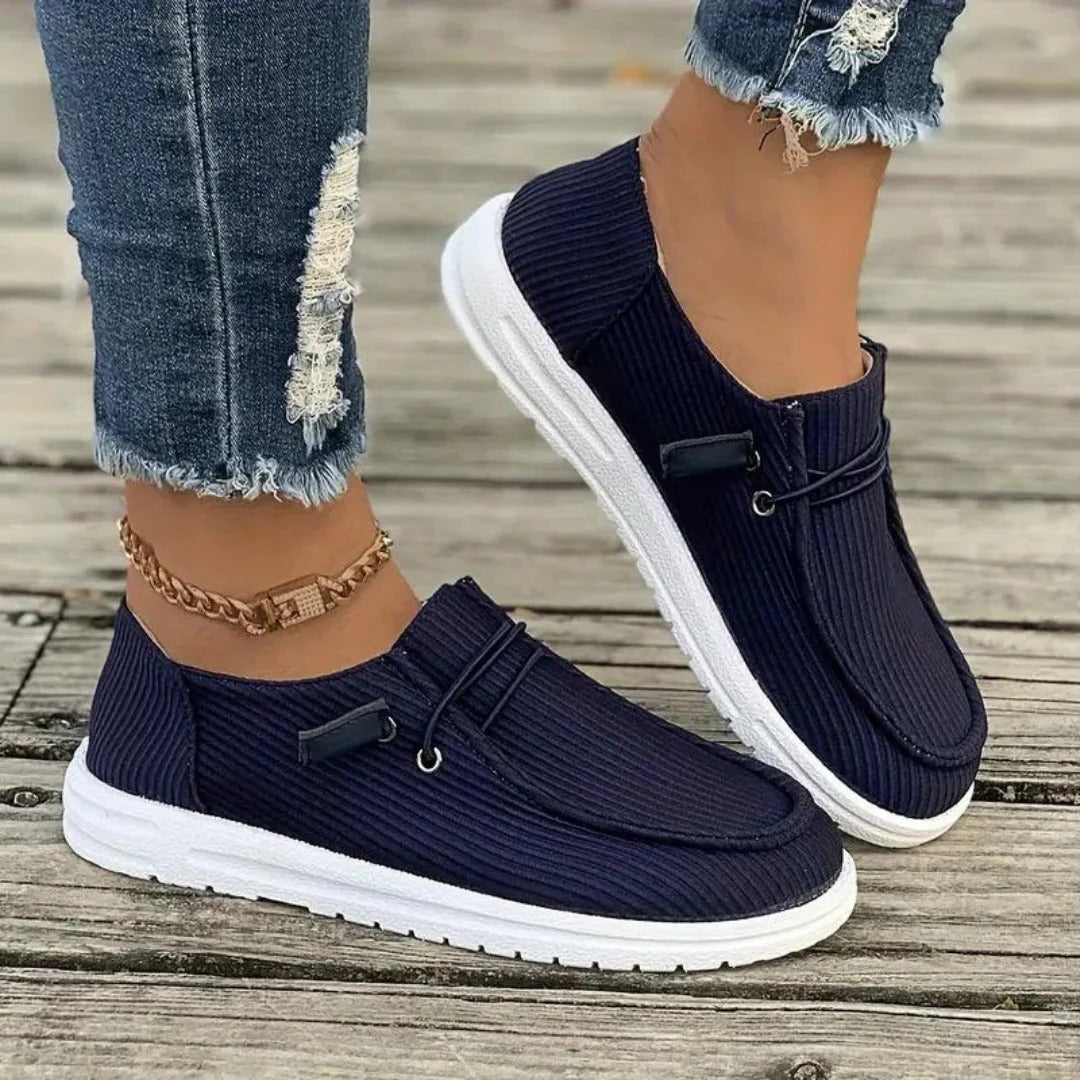 Women's slip-on hiking boots in neutral tones, easy-wear design with supportive relaxed fit