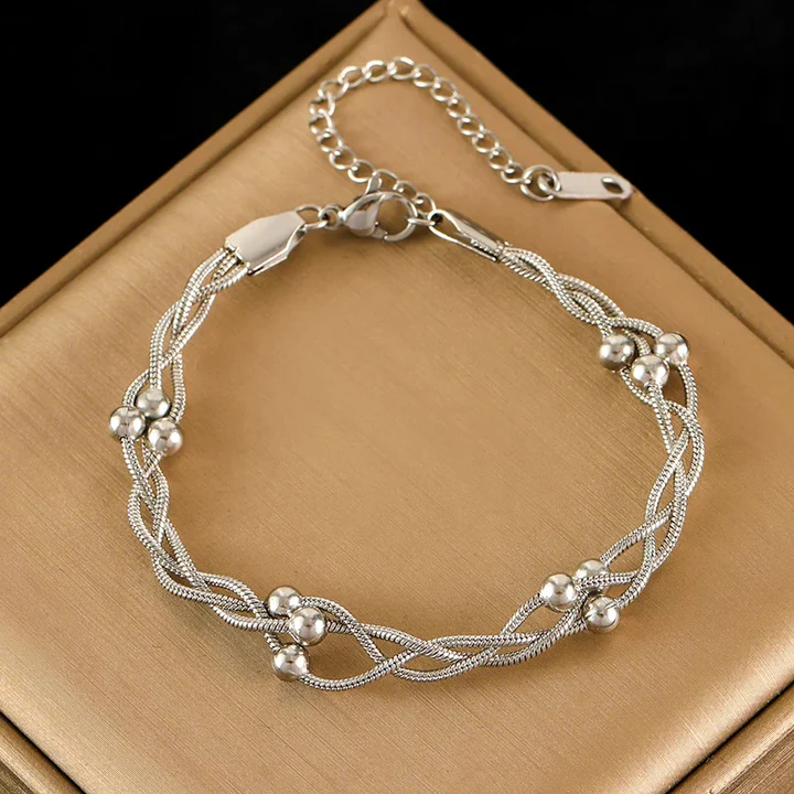 Lyra triple-layer snake chain bracelet in gold or silver with polished beads and lobster clasp