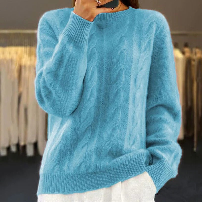 Women's chunky cable knit sweater cozy warm structured silhouette versatile cold season knitwear