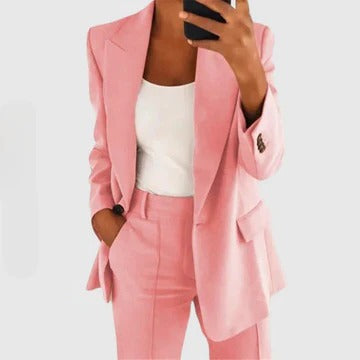 Women's tailored blazer and pants set in classic cut with structured fit and coordinated two-piece design