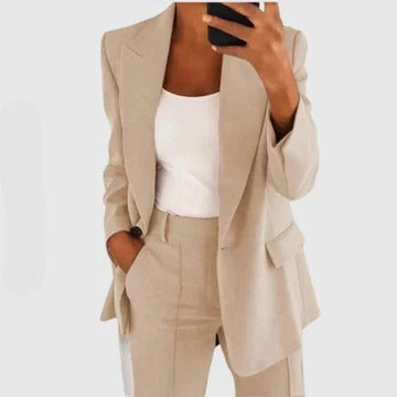 Women's tailored blazer and pants set in classic cut with structured silhouette and matching coord design