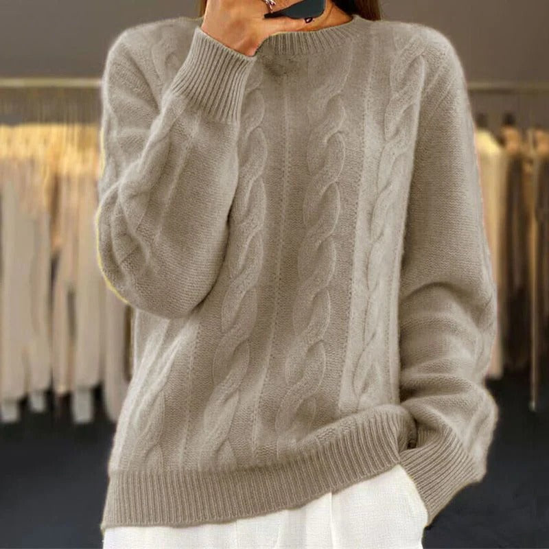 Women's chunky cable knit sweater cozy warm structured silhouette elegant textural premium cold season
