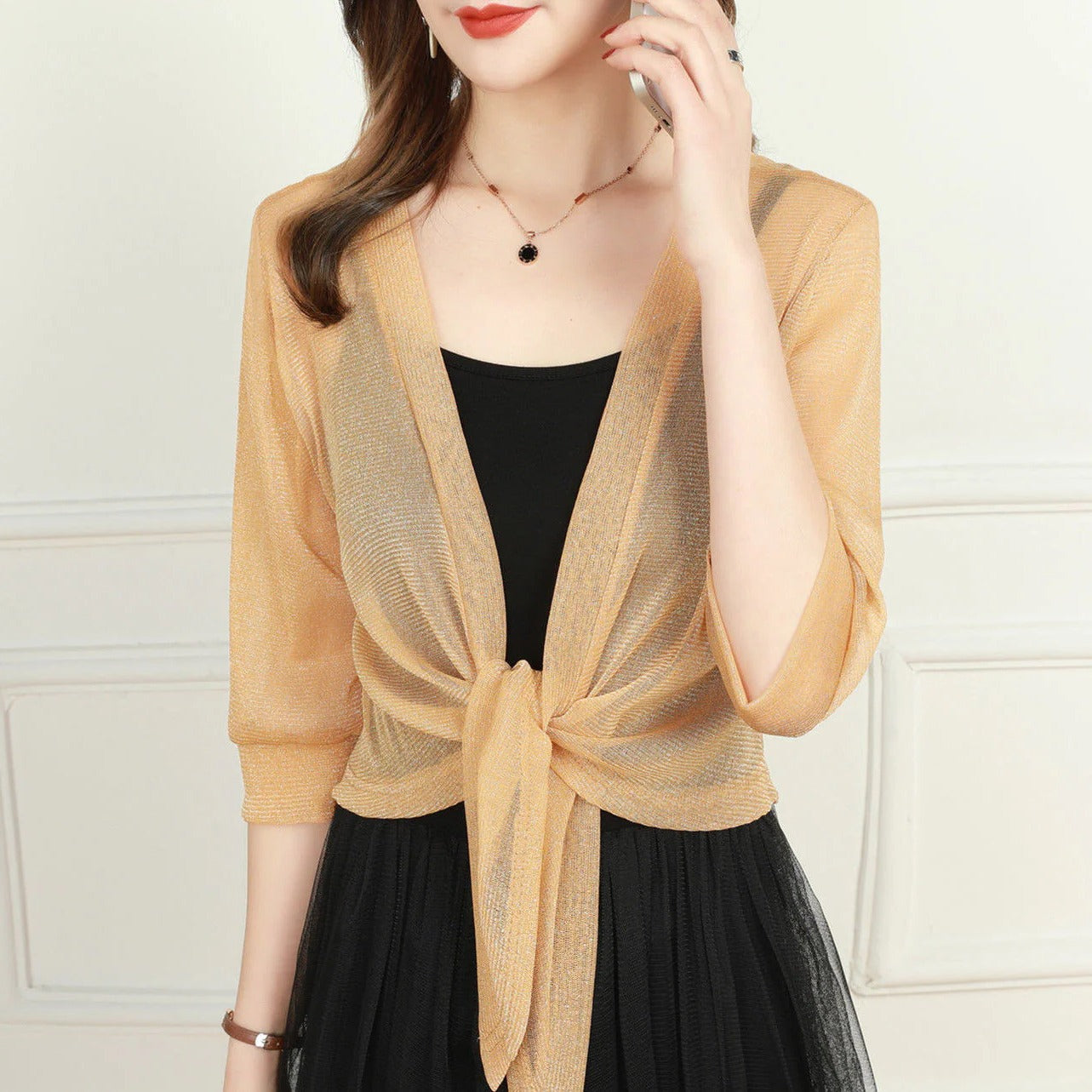 Women's sheer open-front blouse with tie hem and 3/4 sleeves, lightweight layering top