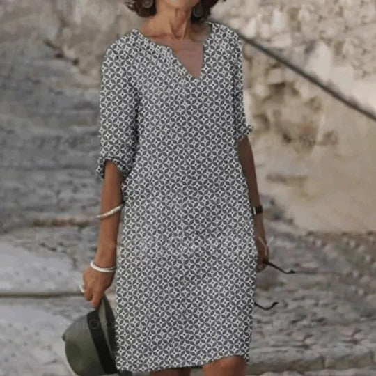 Women's relaxed-fit knee-length dress with wide rounded neckline, lightweight breathable fabric for warm weather