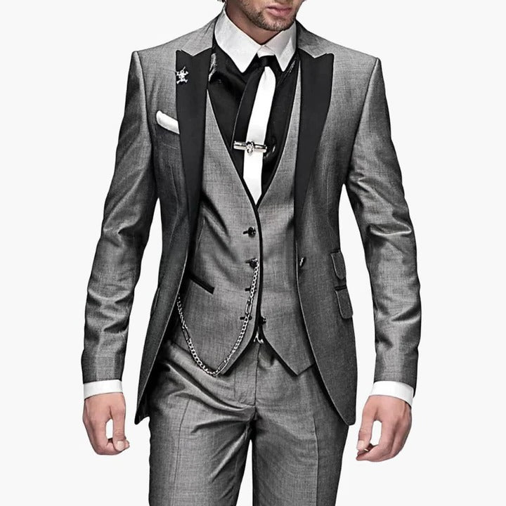 Men's burgundy three-piece tailored suit with black lapels, vest, and trousers for weddings by Wavlynn