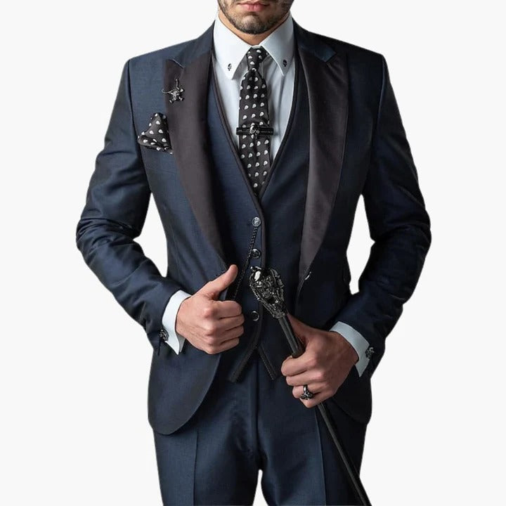 Men's burgundy three-piece tailored suit with black lapels, vest, and trousers for weddings