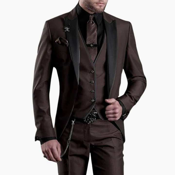 Men's burgundy three-piece tailored suit with black lapels, vest, and trousers for weddings by Wavlynn
