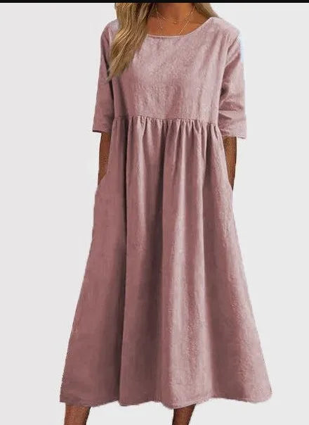 Flowy spring midi dress in soft pastel tones with flattering wrap-style silhouette and floral print