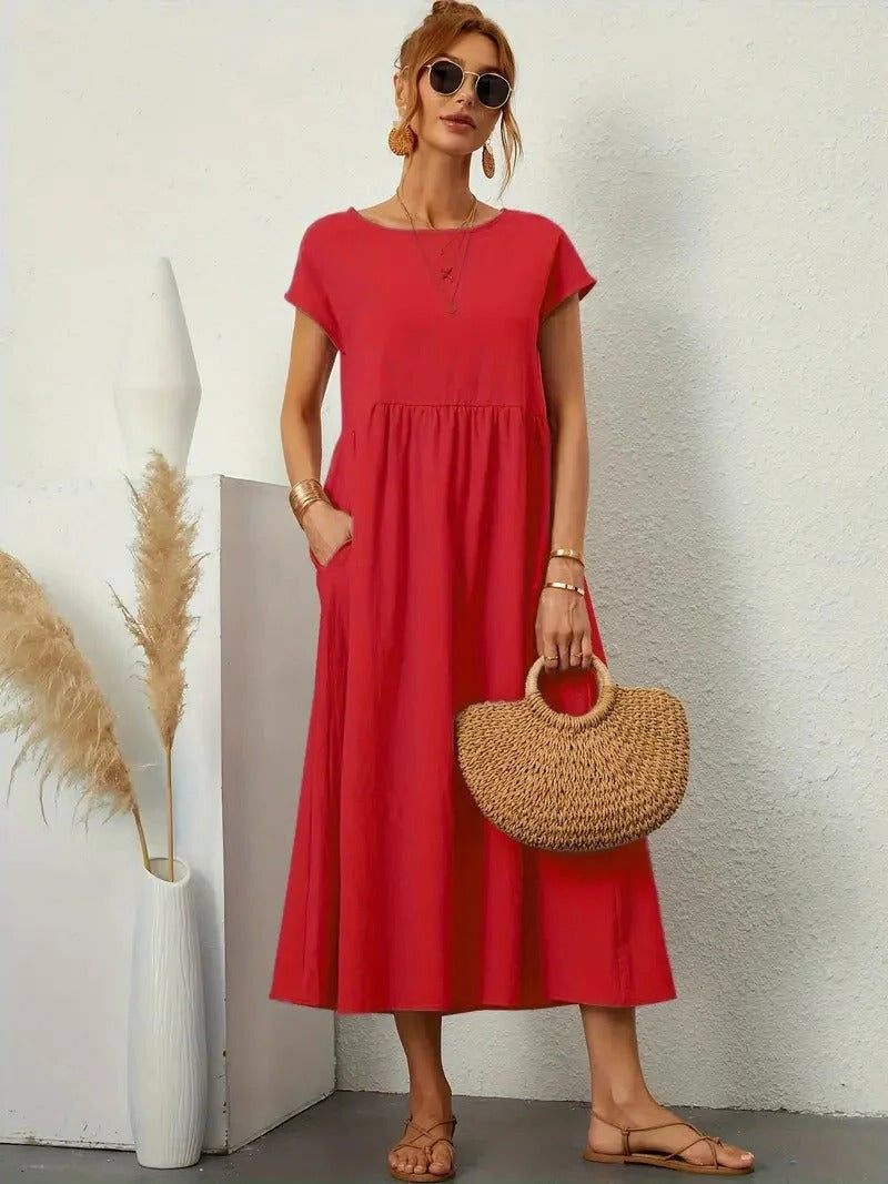 Forest-green elegant women's dress with hidden pockets, flowing silhouette, refined minimalist style