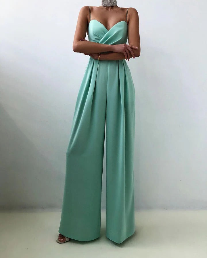 Women's sleeveless jumpsuit with shaped waist, structured silhouette, clean neckline, elegant everyday style