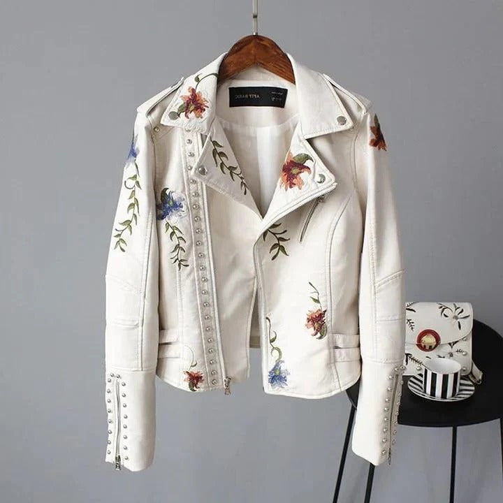 Cropped embroidered jacket with floral stitching, vintage-inspired silhouette in neutral tones