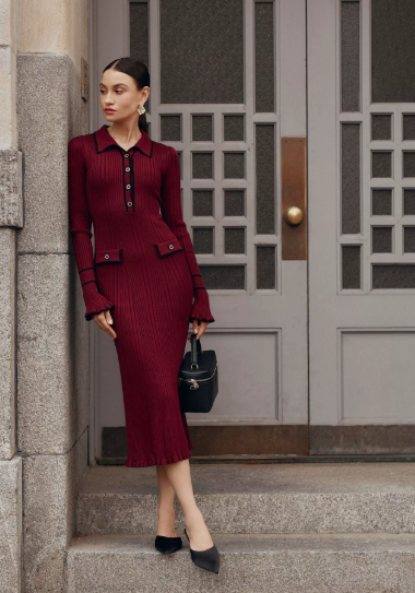Cream ribbed knit midi dress with polo collar, contrast black trim, and gold button placket