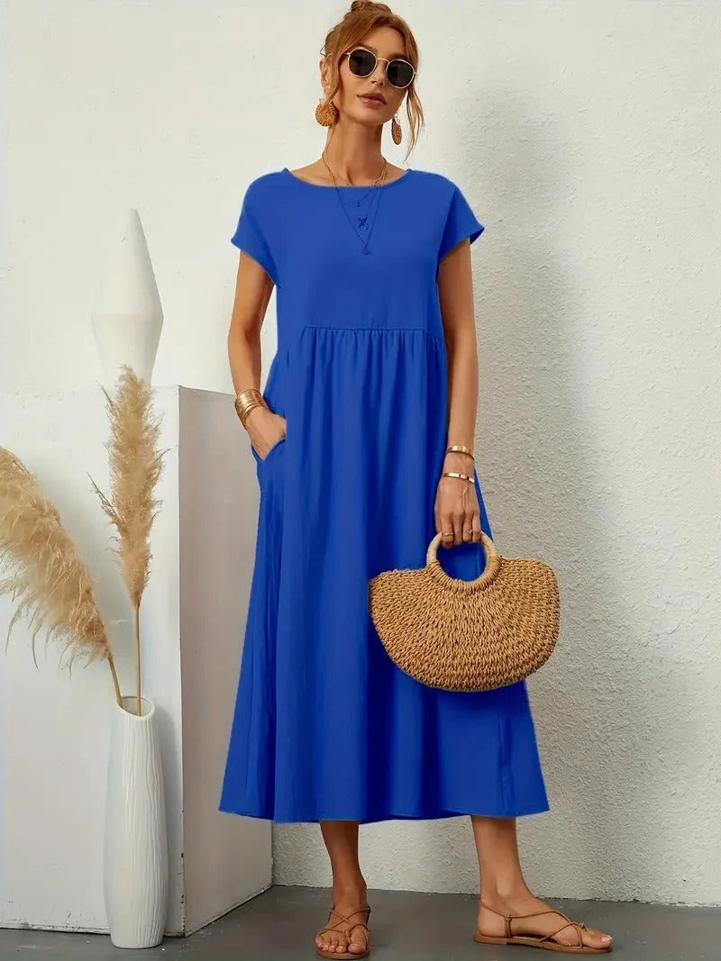 Forest-green women's elegant dress with functional pockets, refined silhouette, effortless everyday style