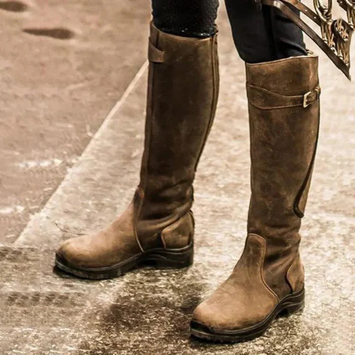Women's black high-top waterproof boots with minimalist design and elevated ankle silhouette