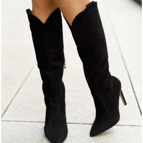 Women's black mid-calf boots with sleek silhouette and convenient side zipper closure