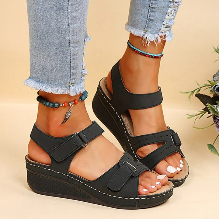 Beige open-toe sandals with adjustable straps, cushioned sole, and casual everyday style