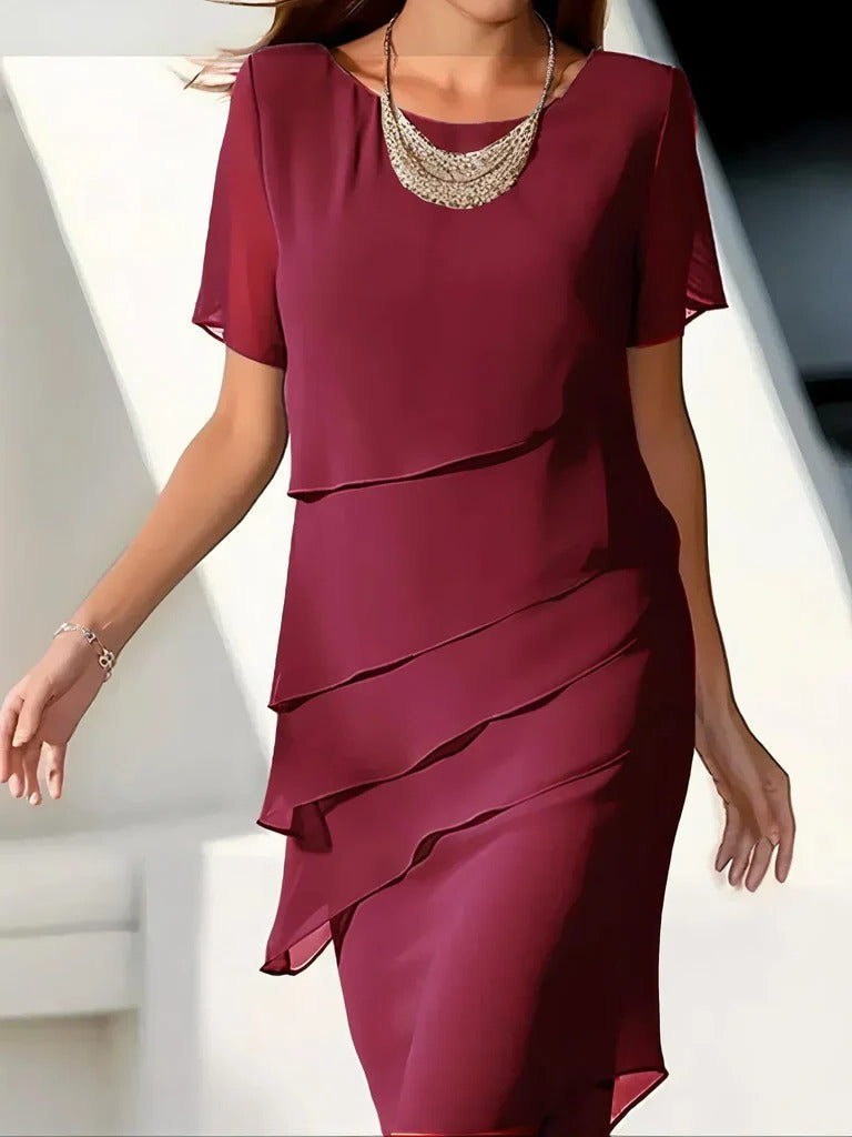 Black slimming dress with structured panel shaping, tailored body-skimming silhouette for versatile wear