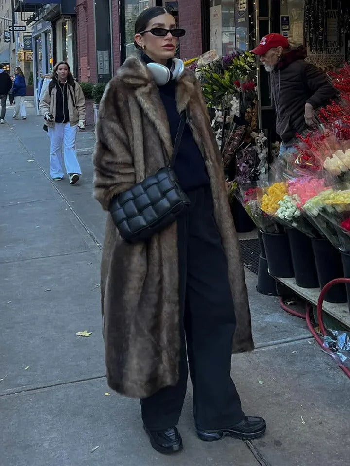 Structured long-cut winter trench coat with relaxed layer-friendly fit for cold seasons