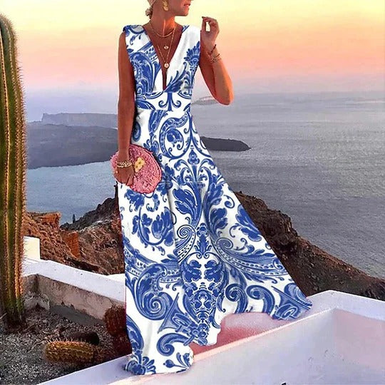 Women's floral sleeveless maxi dress with bold tropical print and deep V-neckline for vacation style