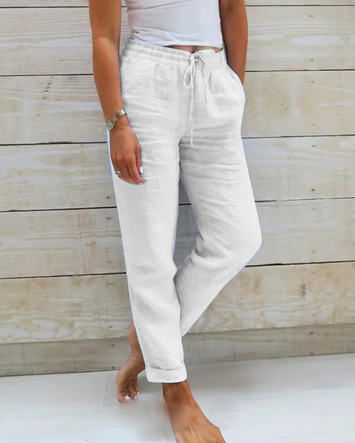 Stretch pants for women in neutral tone, slim contoured cut with flexible waistband for all-day comfort